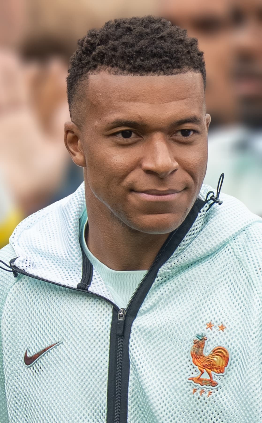 Kylian Mbappé wearing a France training jacket