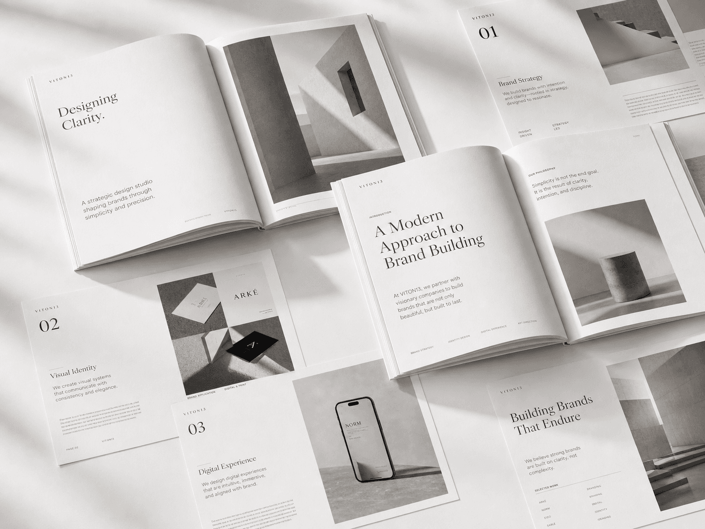 VITON13 editorial design brand book with open magazine spreads, typography layouts, and premium publishing system presentation
