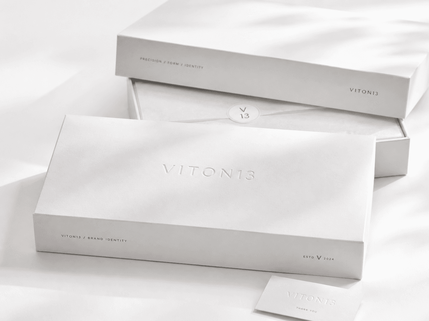 VITON13 premium packaging design with embossed white boxes, refined brand details, and luxury unboxing presentation