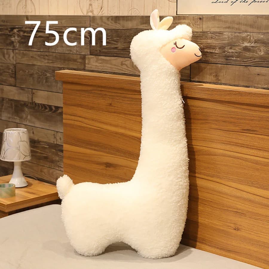 Alpaca de peluche y cojín