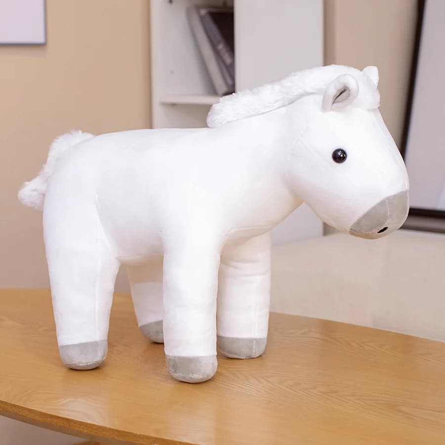 Caballo sentado de peluche