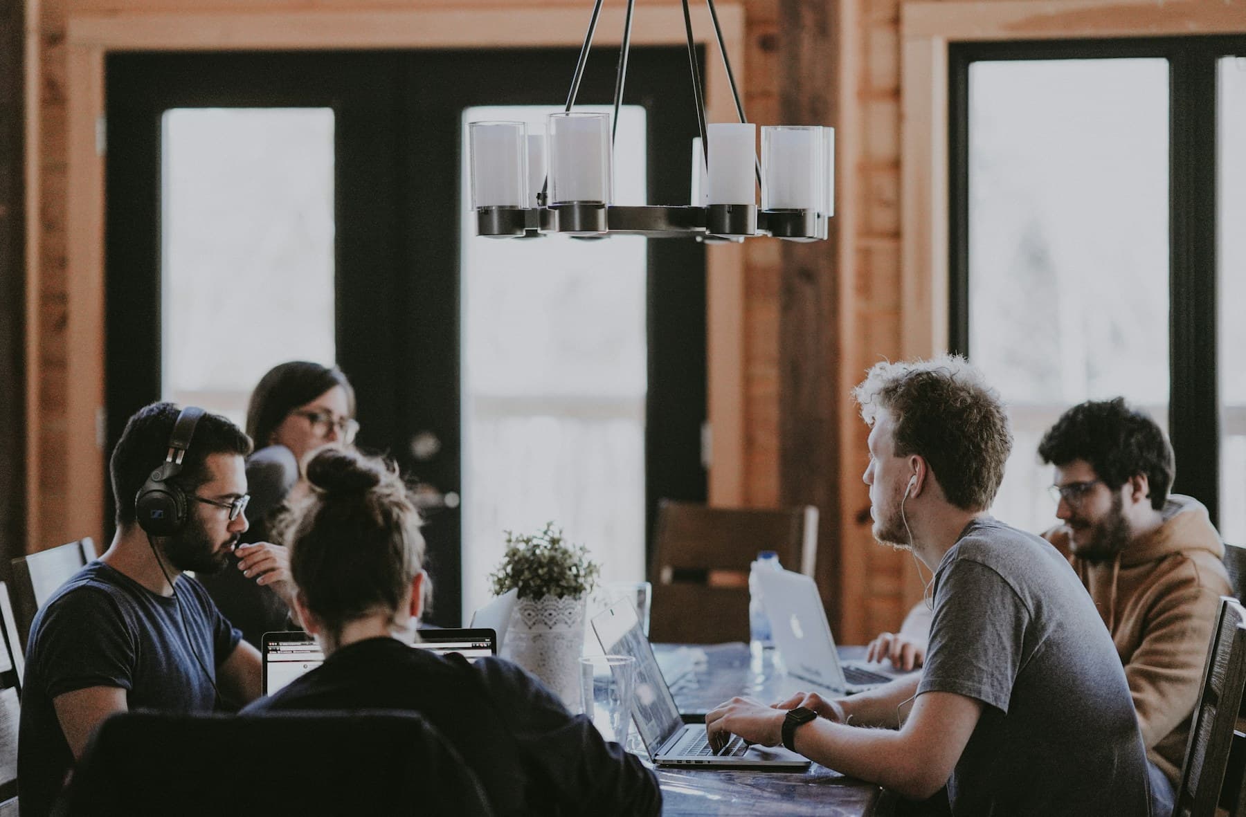 Colleagues seated around a table during a working meeting