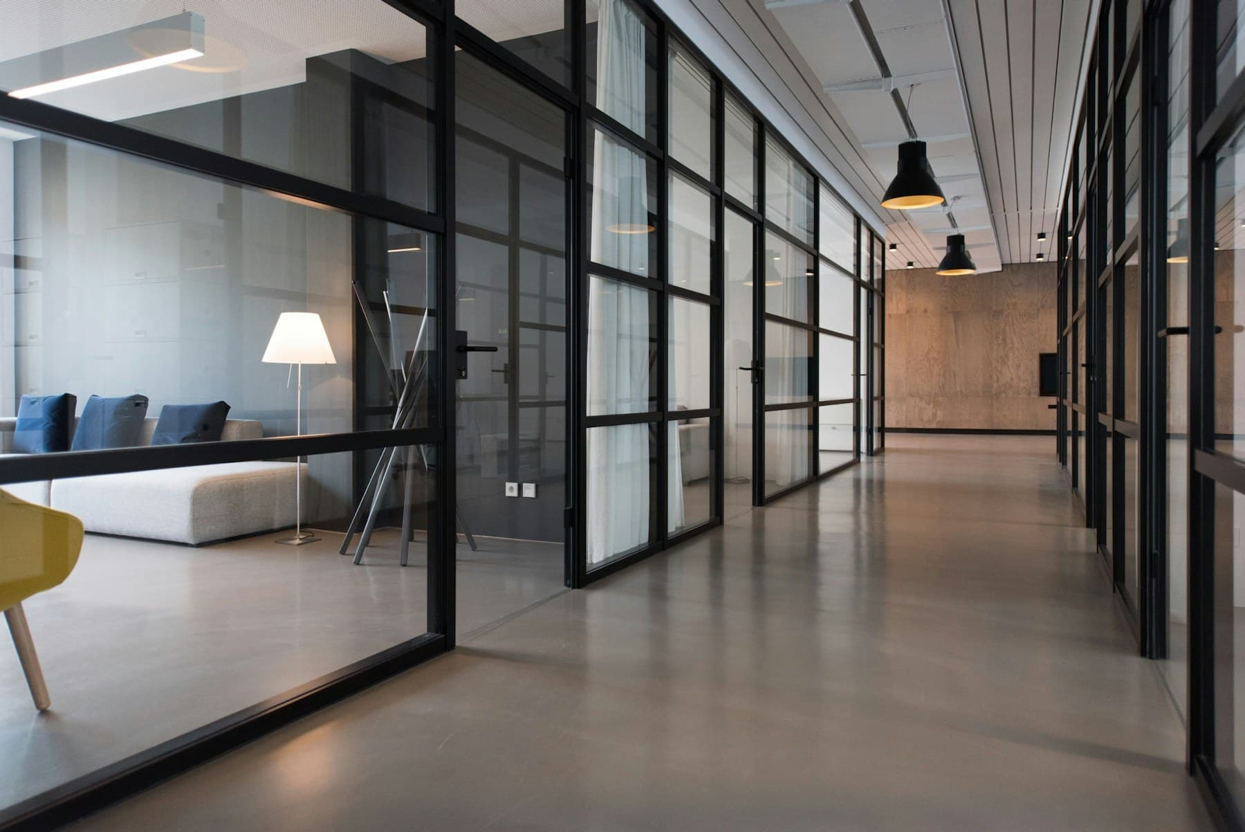 Empty modern office interior behind glass partitions